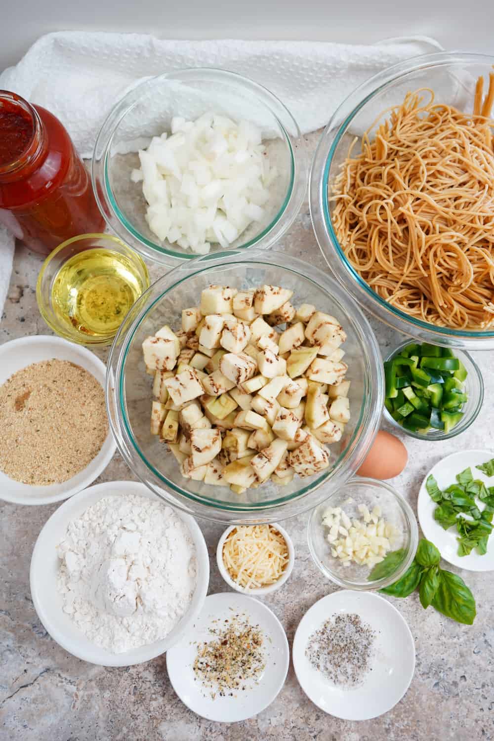 Air Fried Eggplant Pasta Ingredients: whole wheat pasta, basil, garlic, spices, parmesan cheese, onion, and olive oil.