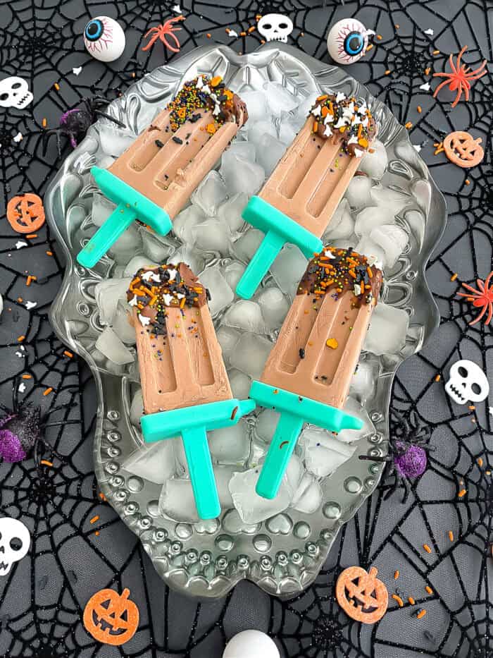 Healthy Halloween popsicles decorated with fruit