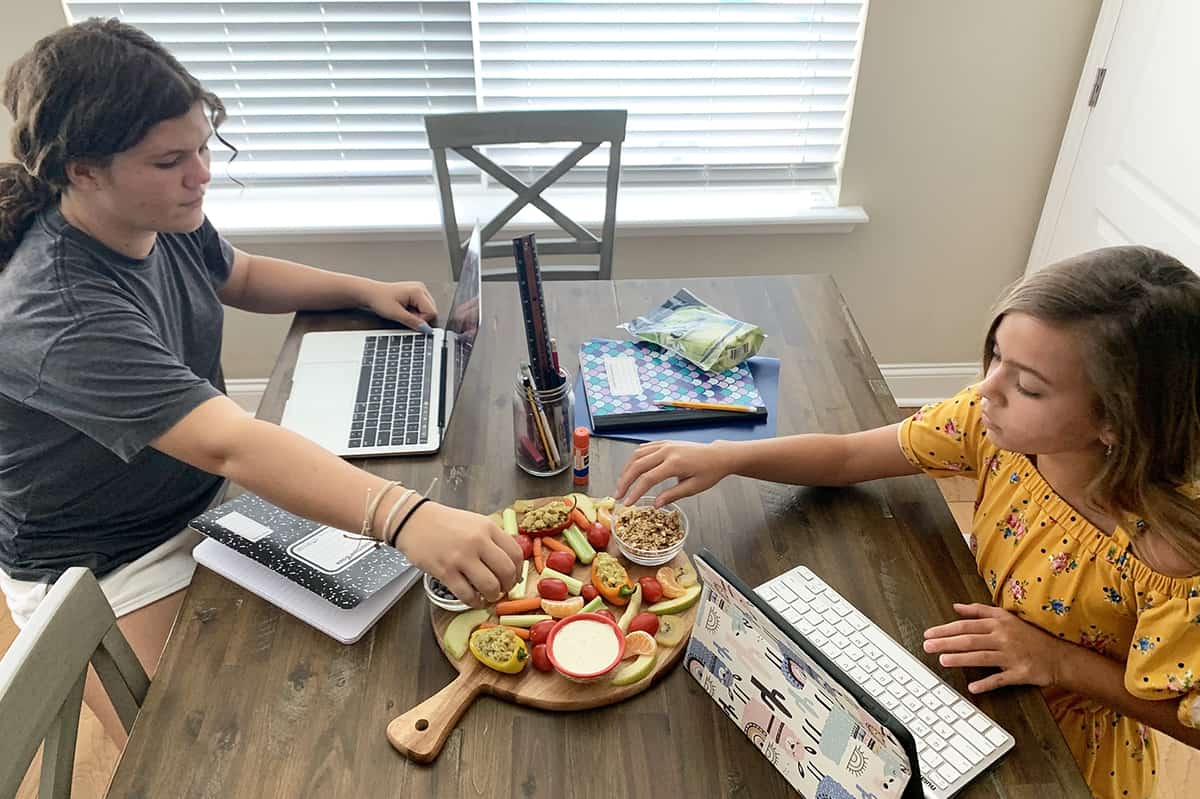 Kids eating snack board